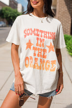 Load image into Gallery viewer, White SOMETHING IN THE ORANGE Graphic Crew Neck T Shirt
